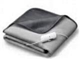 Grey blanket folded with heating control on cord